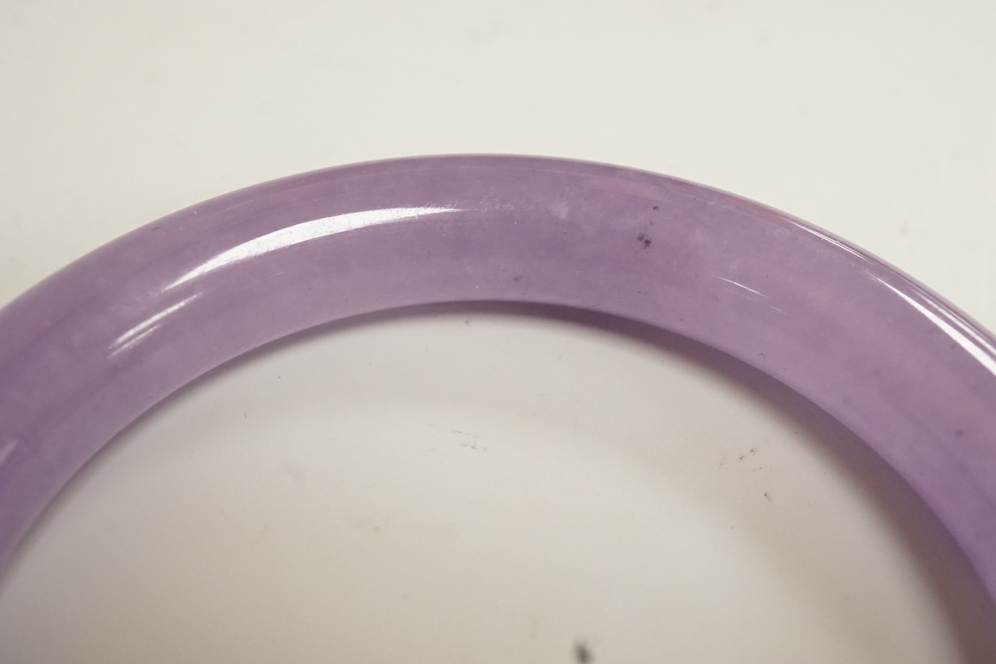 A lavender hardstone bangle, 8cm wide